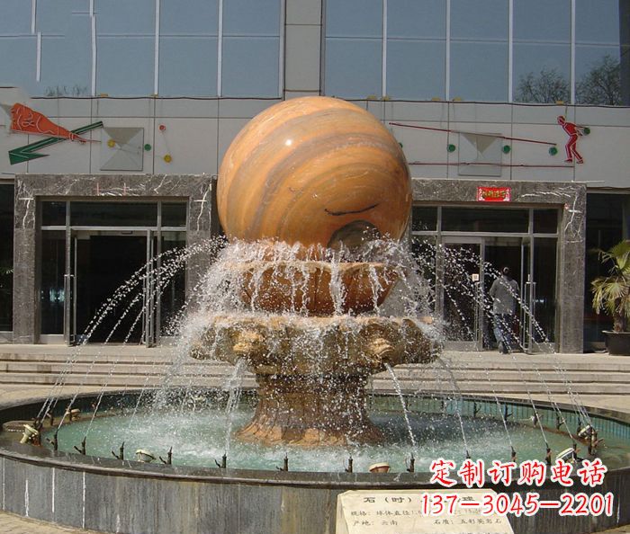 内蒙古石来运转球晚霞红风水球石雕
